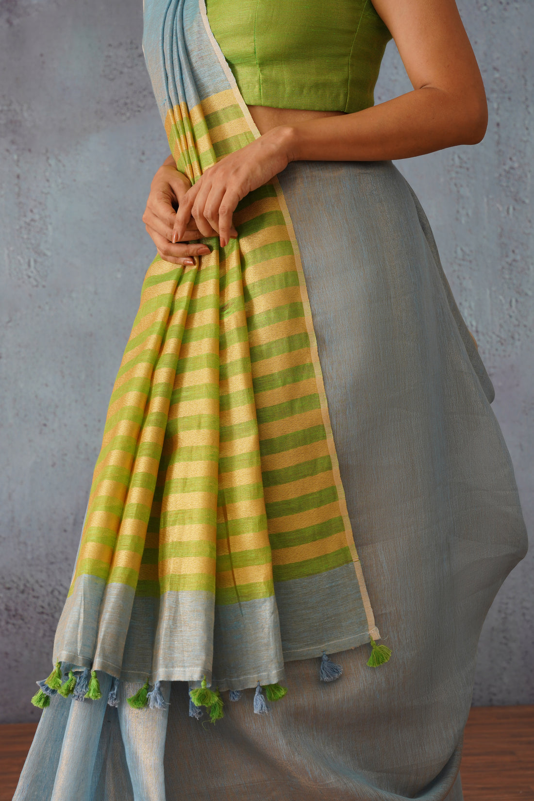 Pastel Blue Linen Zari Sari with Green, Gold Stripe Pallu