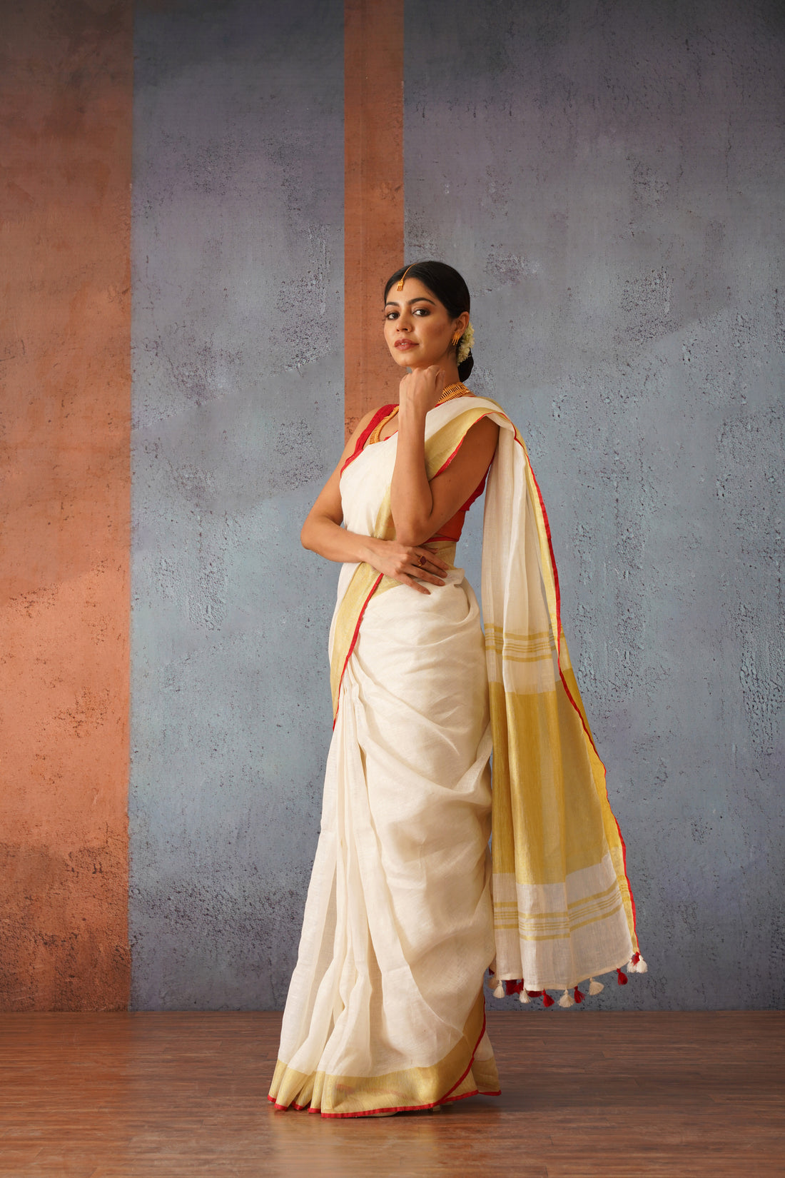 Festive Off White Handloom Linen Sari with Red Border & Gold Zari Pallu