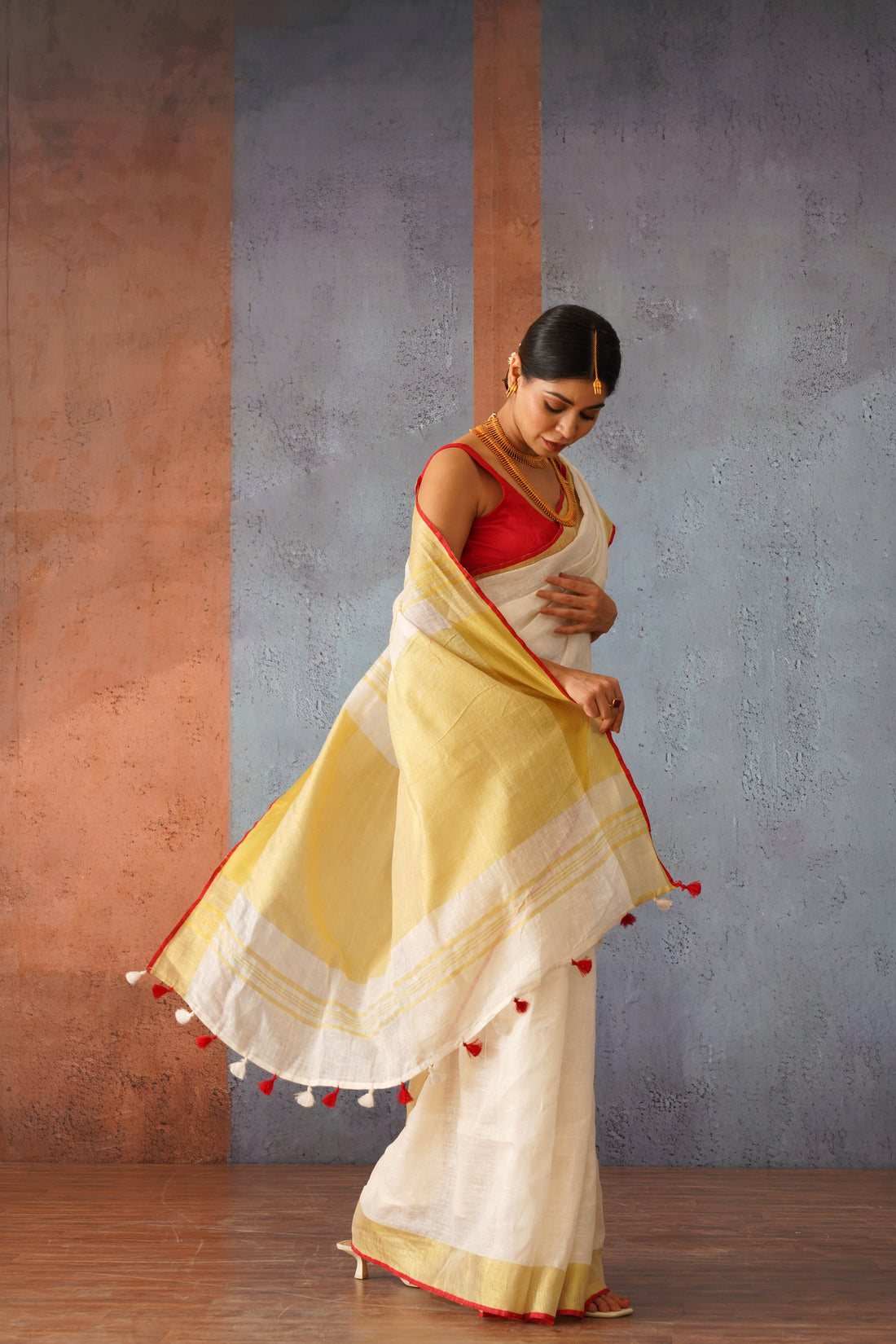 Festive Off White Handloom Linen Sari with Red Border & Gold Zari Pallu