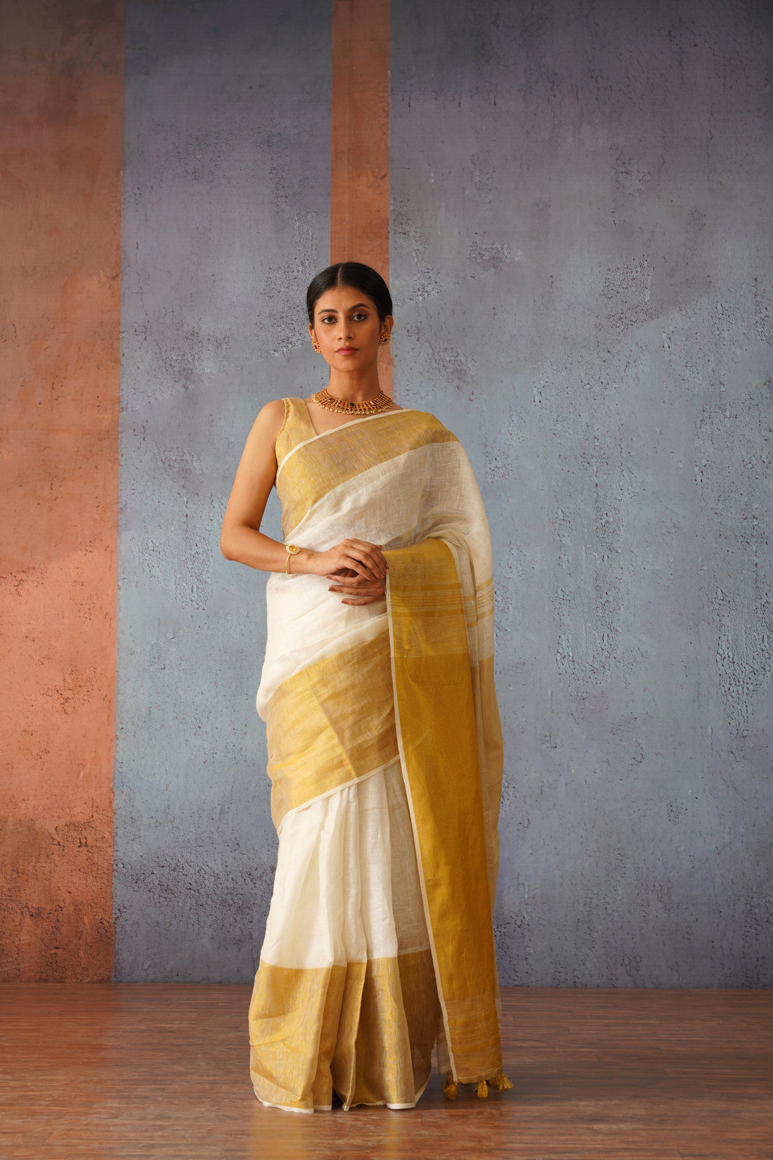 Off White Linen Sari with Gold Zari pallu