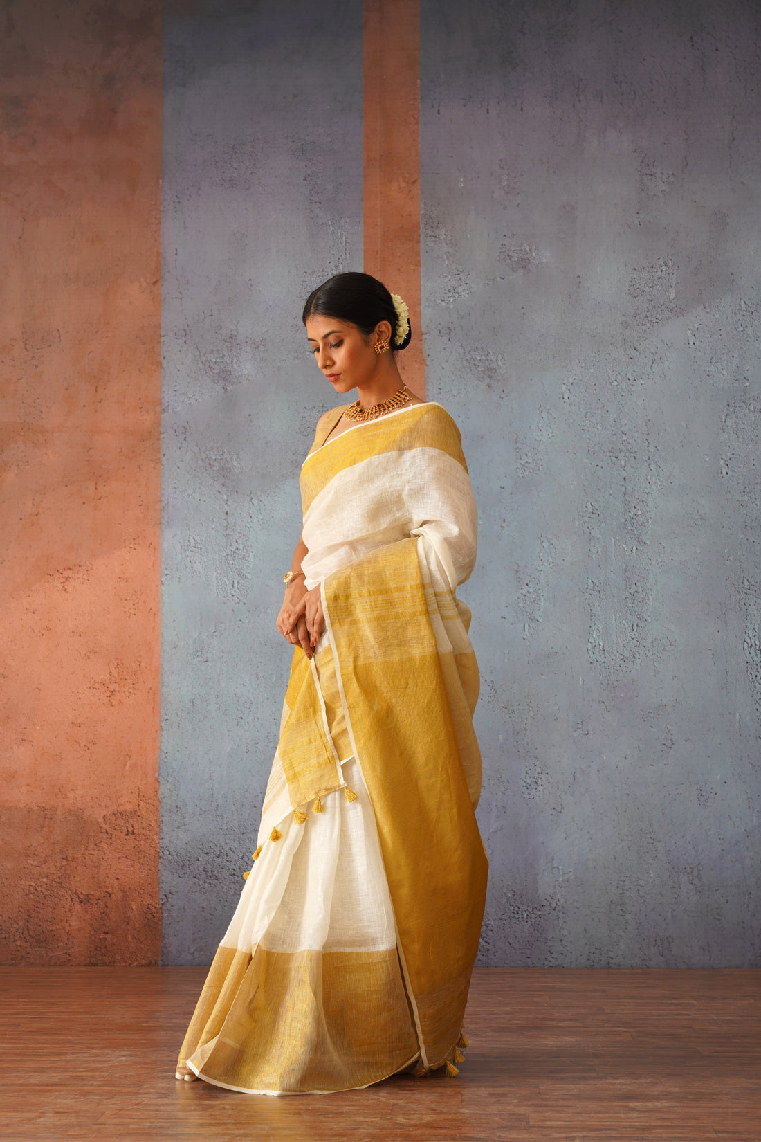 Off White Linen Sari with Gold Zari pallu