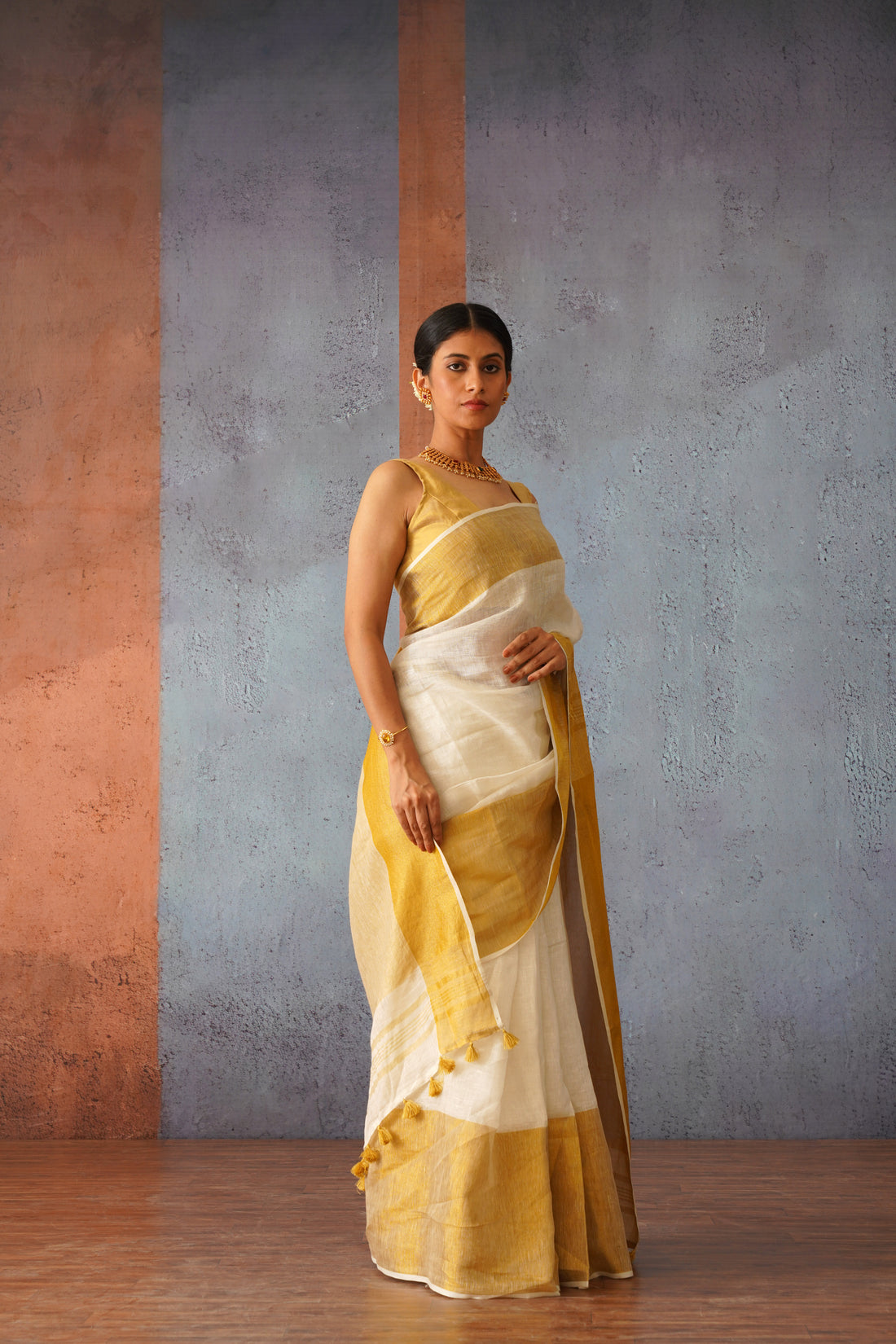 Off White Linen Sari with Gold Zari pallu